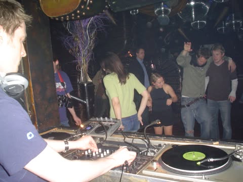 A picture of Dan DJ'ing at a club